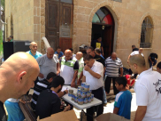 بالصور: جمعية يافا للاعمال الخيرية تُباشر بتوزيع الحصالة الرمضانية على أطفال المدينة 